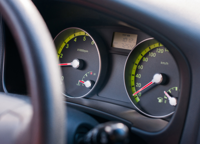 The dashboard of car within speed limits. Very shallow depth of field
