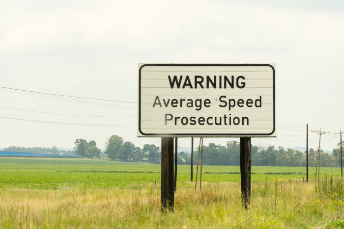 road sign or signage warning average speed prosecution for motorists or drivers to slow down or risk getting a traffic fine concept speed safety