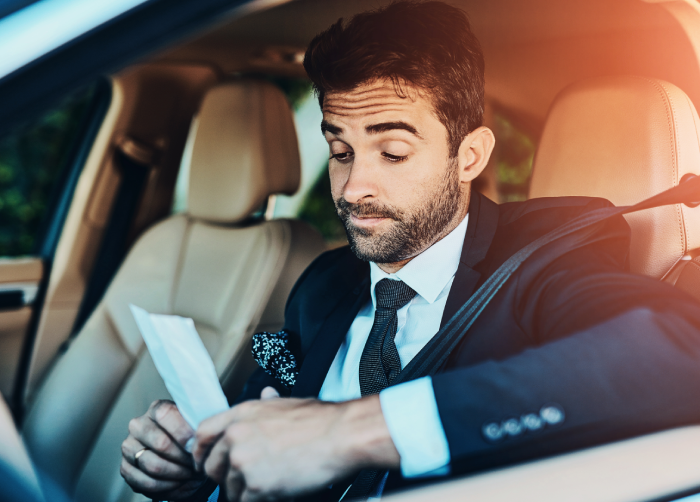 Car, travel and business man with fine for speeding, traffic law and compliance on commute, journey and trip.