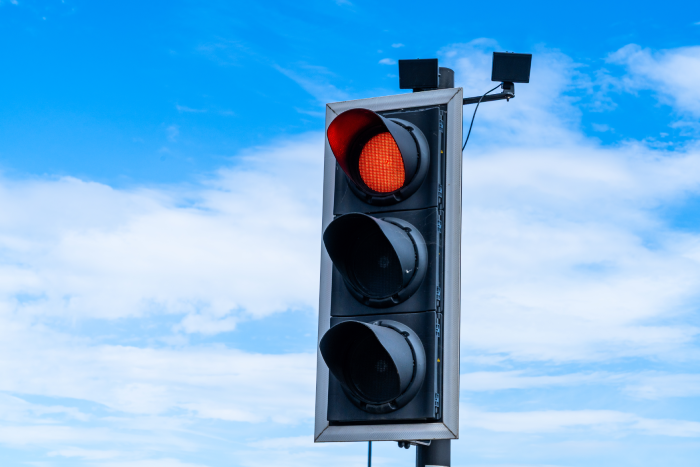 UK traffic light system on red for stop, transportation or driving element
