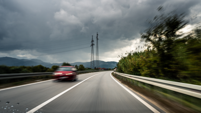 Rainy Highway Perspective Capturing Speed, Danger, and the Risk of Reckless Driving on a Stormy, Overcast Day