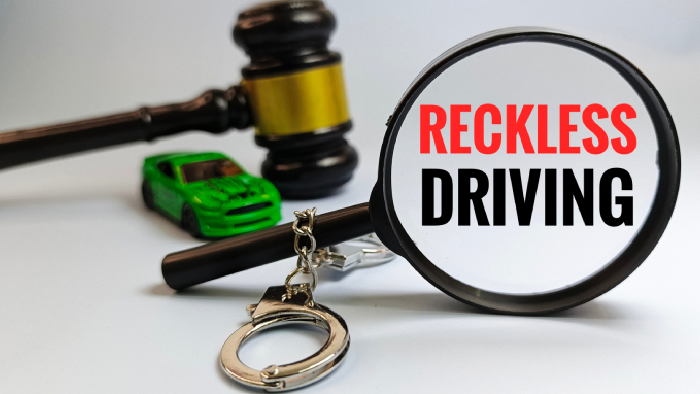 Reckless Driving Concept Seen Through Magnifying Glass with Judge Gavel, Handcuffs, and Car – Traffic Crime and Legal Enforcement Illustration.