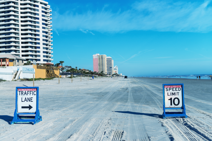 Daytona Beach, Florida. Road traffic signs on the beach.