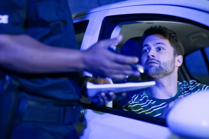 Man, police and stop car for ticket, registration check and traffic warning of speeding.